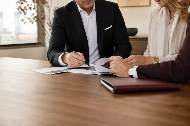 A financial planning discussion around a shared document